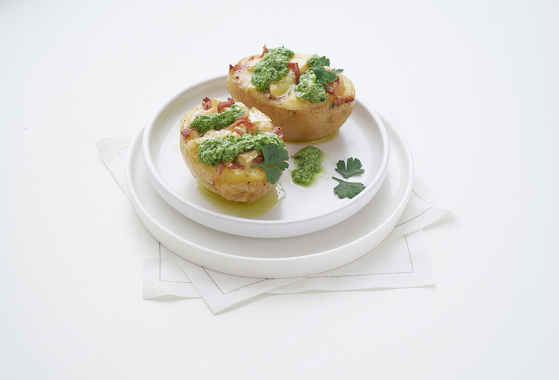 Stuffed potatoes with brie, bacon and parsley sauce