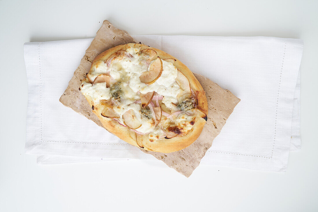 Tarte flambée with ricotta, gorgonzola and pear