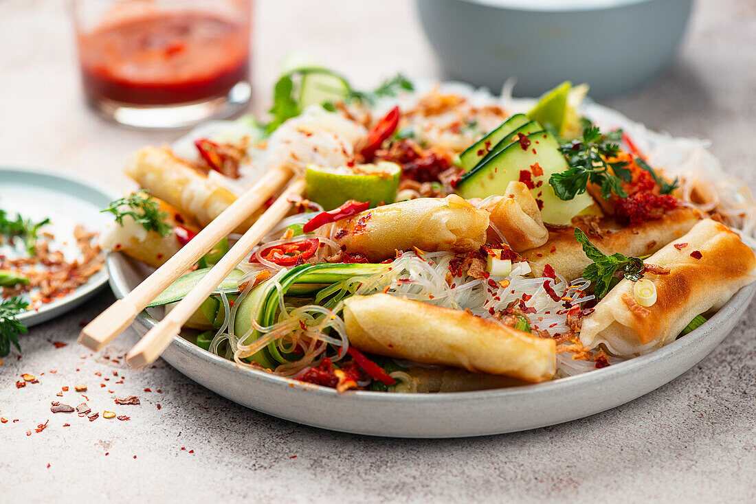 Glass noodle salad with spring rolls