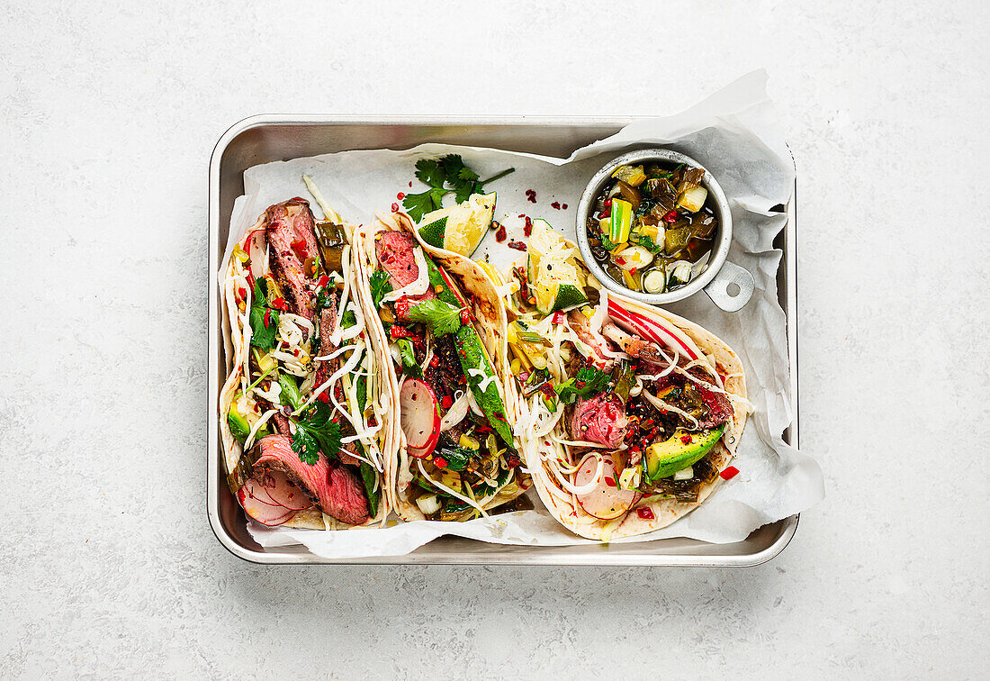 Steak tacos with spring onion salsa