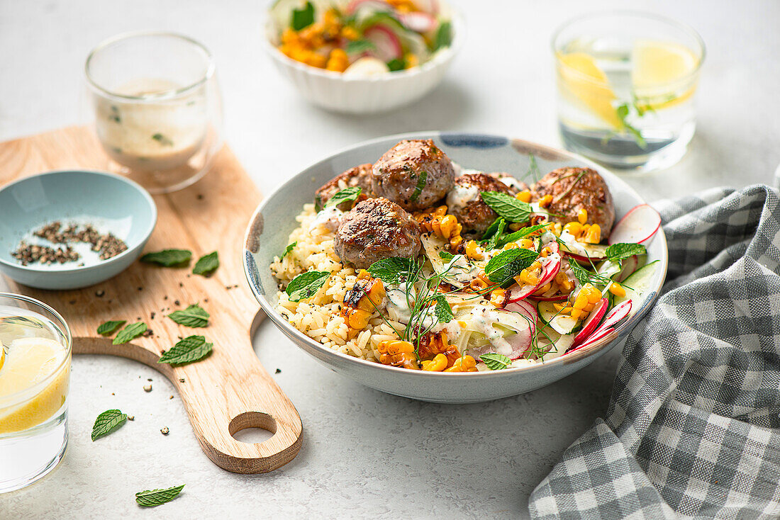 Bowl with turkey meatballs, rice and fennel