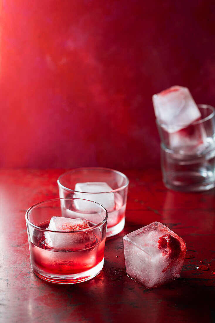 Raspberry cocktail with ice cubes