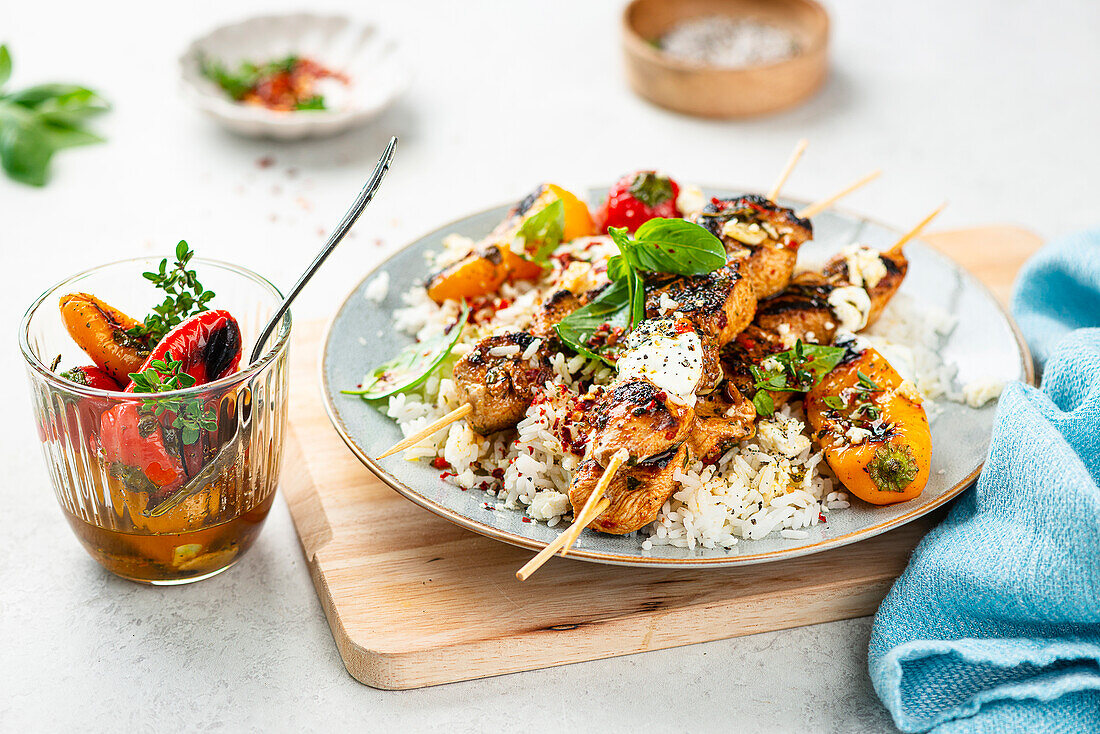Tzatziki rice bowl with chicken skewers and grilled peppers
