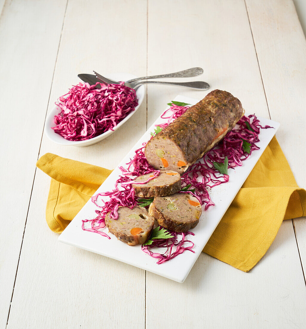 Meatloaf stuffed with vegetables and red cabbage