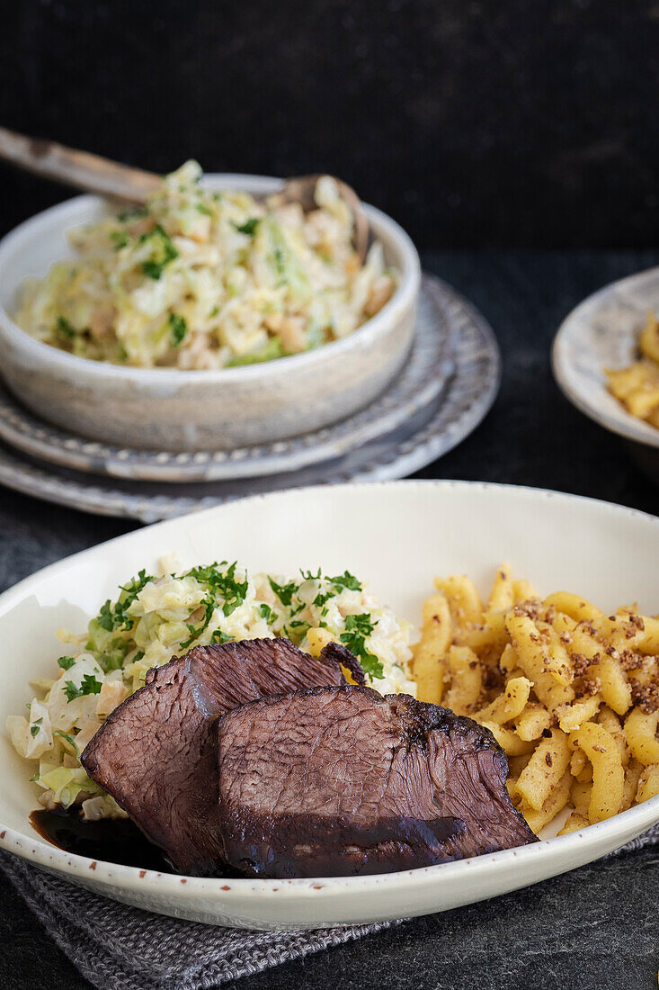 Roast beef with spaetzle and white cabbage