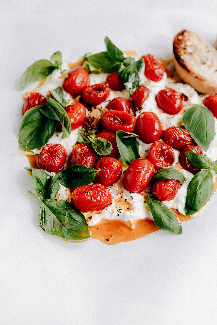 Burrata with cherry tomatoes, garlic, olive oil and basil