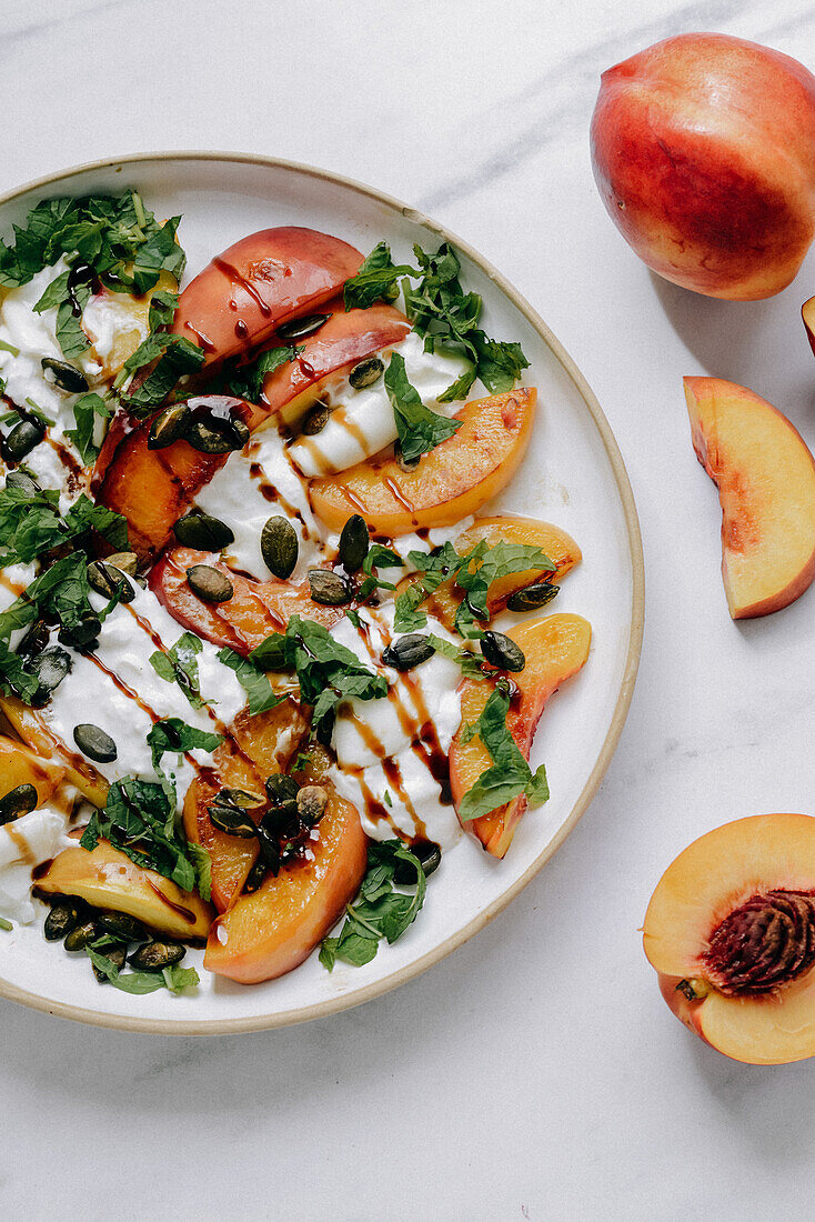 Burrata with nectarines, pumpkin seeds, balsamic vinegar and mint