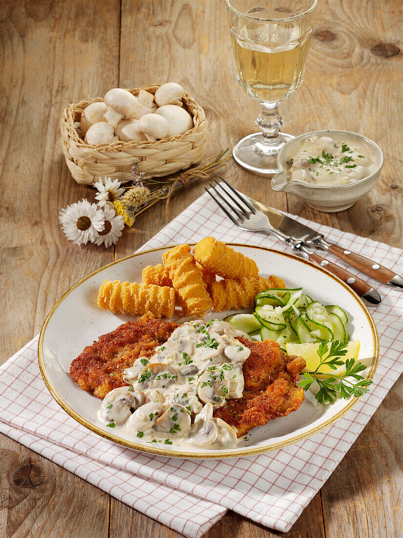 Jägerschnitzel with mushroom cream and croquettes