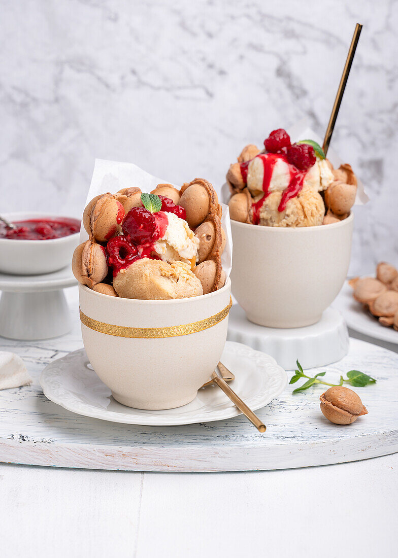 Vegan bubble waffles with ice cream and hot raspberries