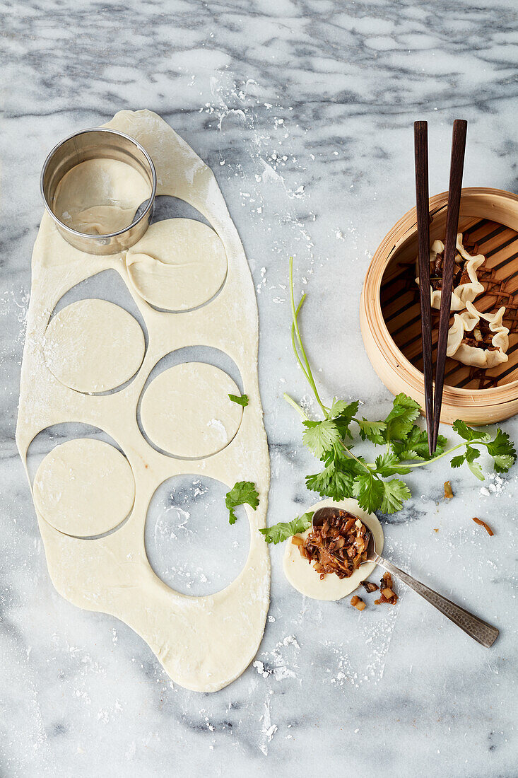 Cut out circles of dough for dumplings