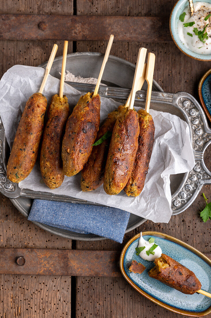 Vegan chickpea and walnut kofta on a skewer