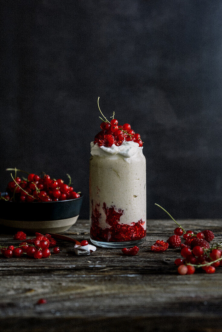Yoghurt dessert with raspberries and redcurrants