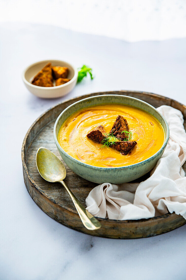 Carrot and fennel soup with crispy tempeh and honey