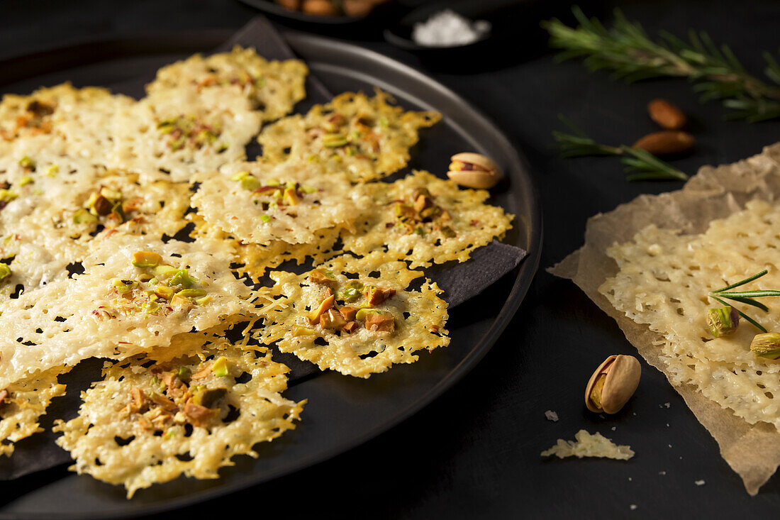 Parmesan crisps with pistachio nuts