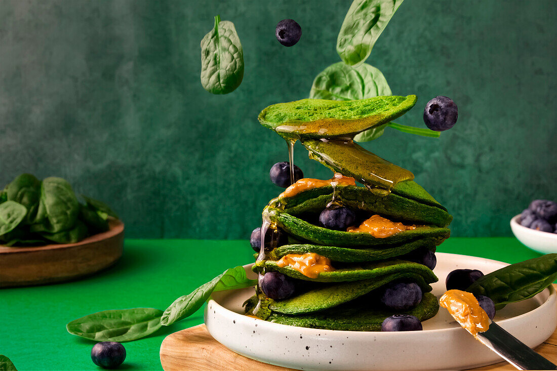 Spinach pancakes with blueberries
