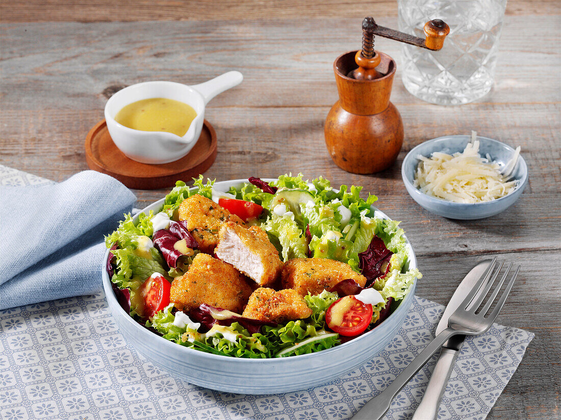 Salad with parmesan poultry cubes