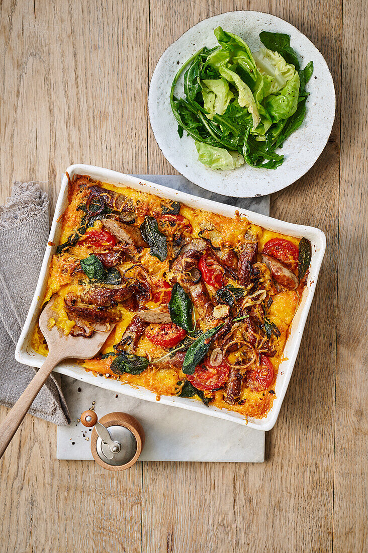 Hearty sausage and potato gratin with tomatoes and sage