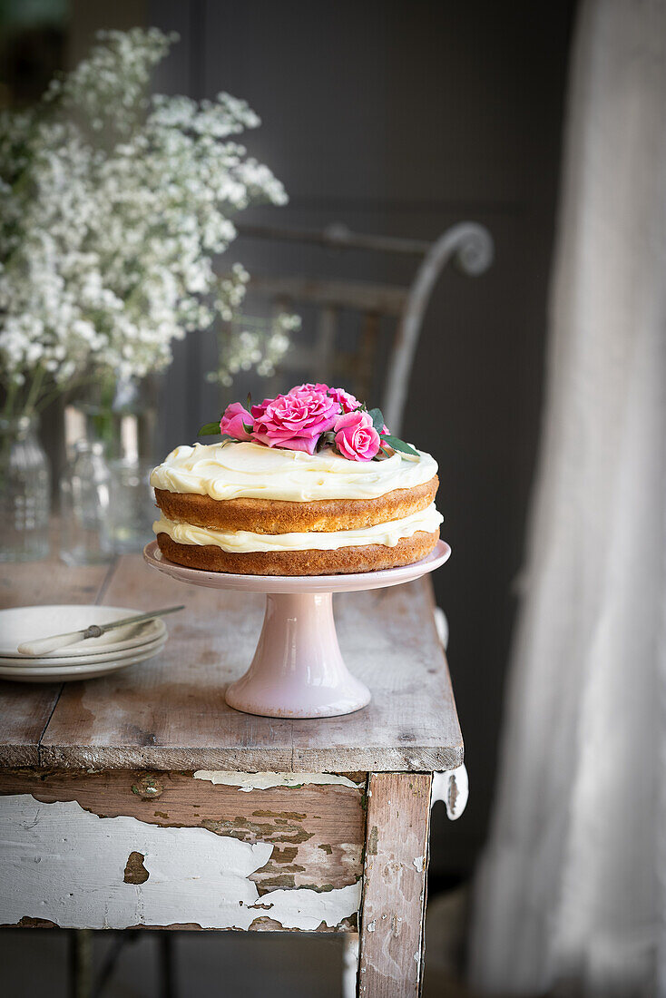 Vanilla naked cake with rose petals