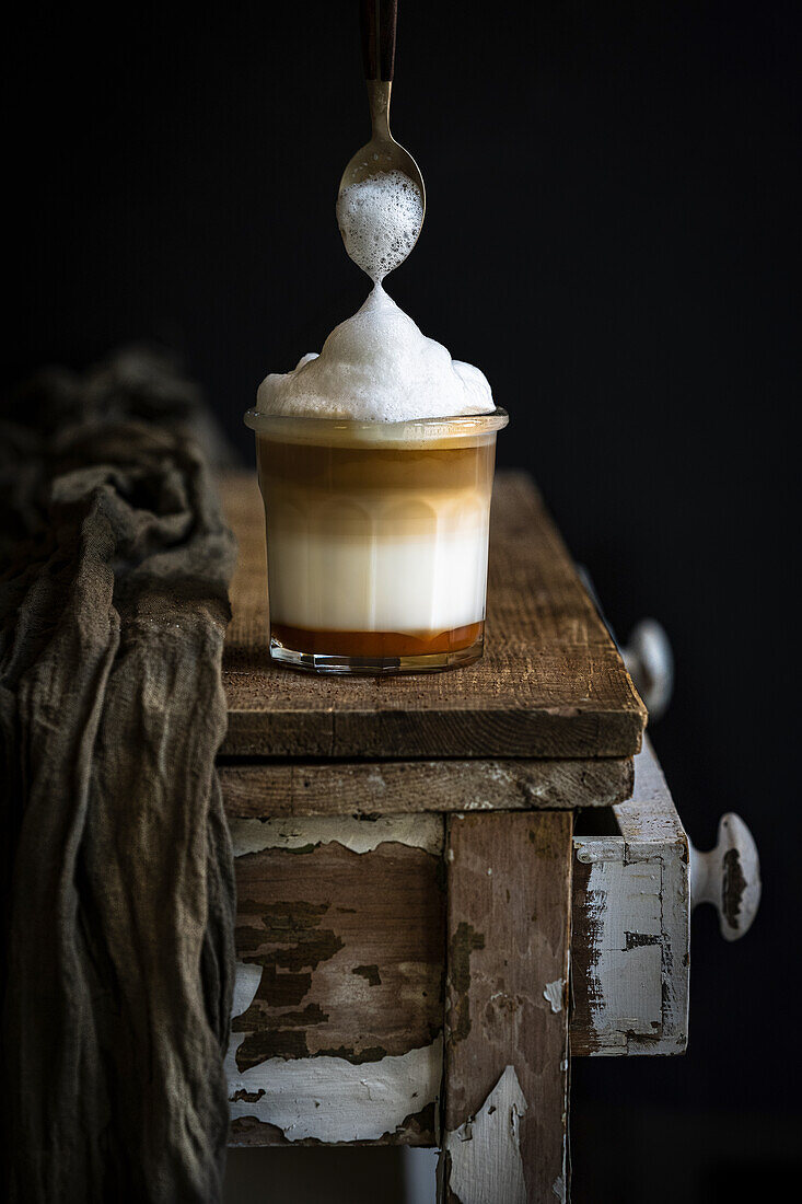 Coffee in layers of milk and foam