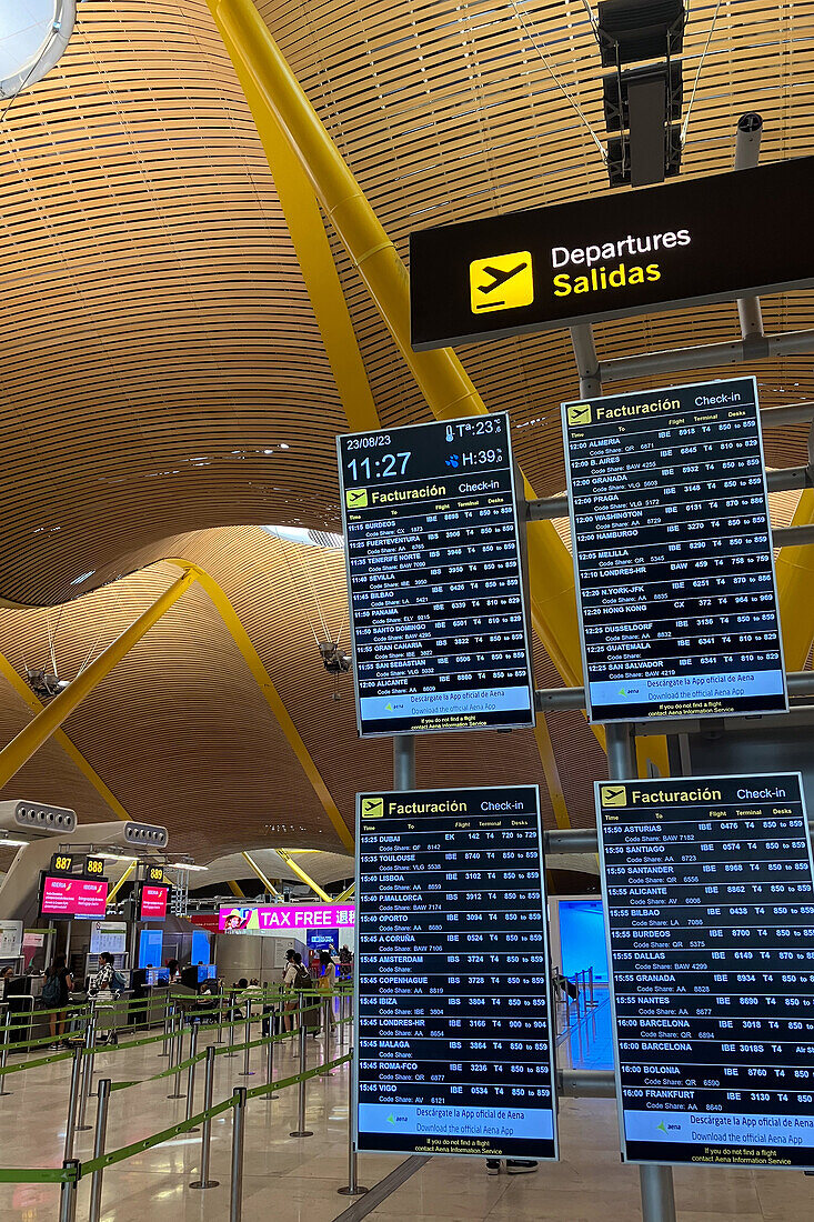 Departure information boards in Madrid Airport, Spain