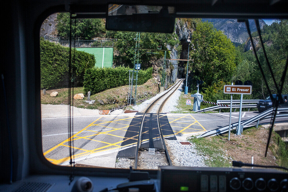 Views from the window. Cogwheel railway Cremallera de Núria train in the Vall de Núria valley, Pyrenees, northern Catalonia, Spain, Europe.