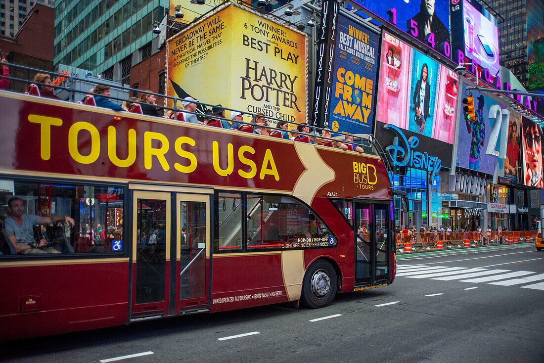 Hop On Hop Off city tour bus on Times Square. Manhattan, New York City, USA.