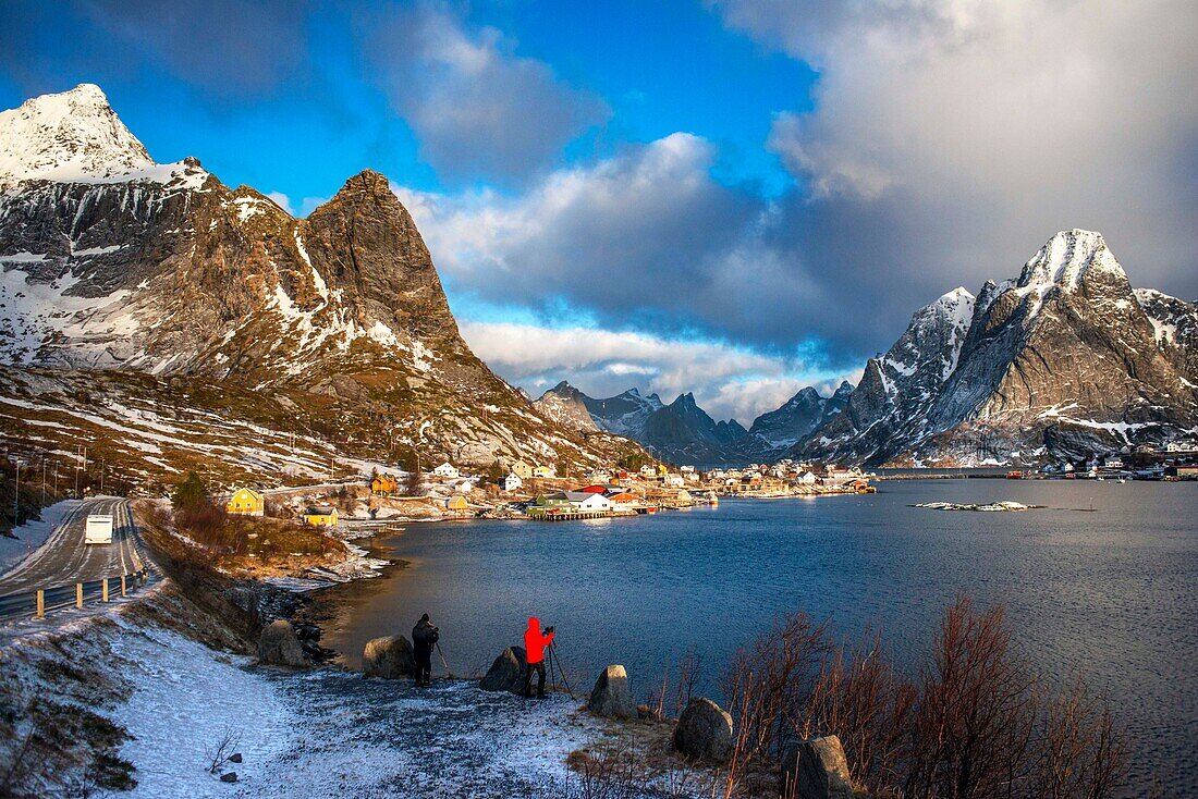 View across the natural fishing harbour to towering mountains above Reine, Moskenes, Moskenesøya Island, Lofoten Islands, Norway