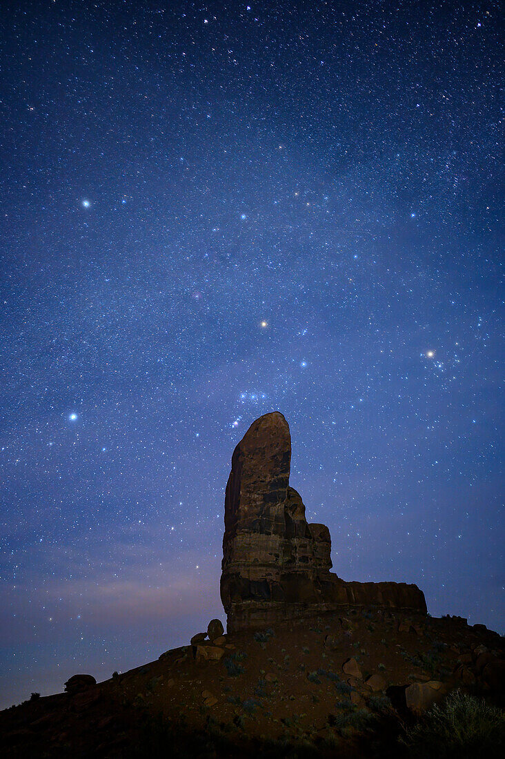 Stars over The Thumb sandstone formation in Monument Valley Navajo Tribal Park, Arizona.