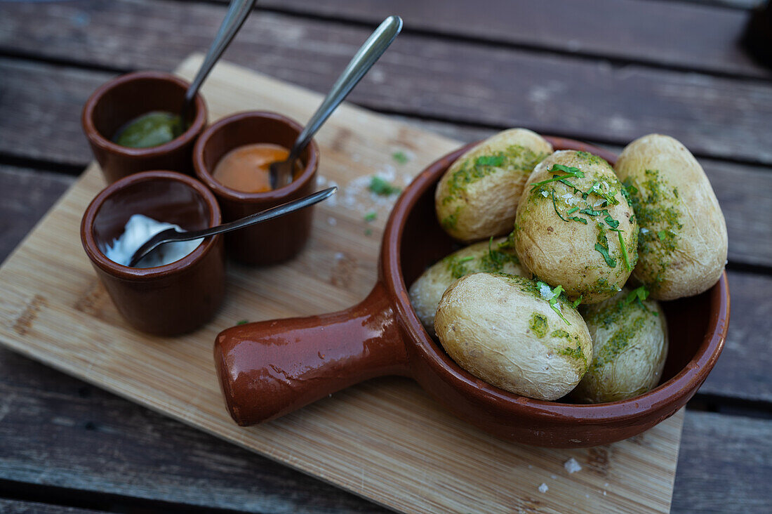 Traditional papas arrugadas con mojo picon at The Lagomar Museum, also known as Omar Sharif's House, unique former home incorporating natural lava caves, now a restaurant, bar & art gallery in Lanzarote, Canary Islands, Spain