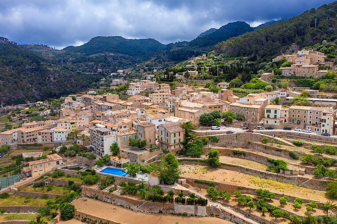 Aerial view of Majorca west coast Mallorca, Banyalbufar, mountain village and terrace fields, Serra de Tramuntana, Mallorca, Balearic Islands, Spain.