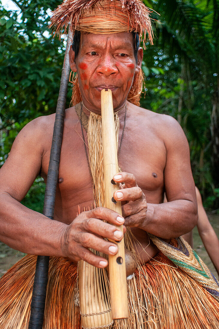 Flute drums music of Yagua Indians living a traditional life near the Amazonian city of Iquitos, Peru.