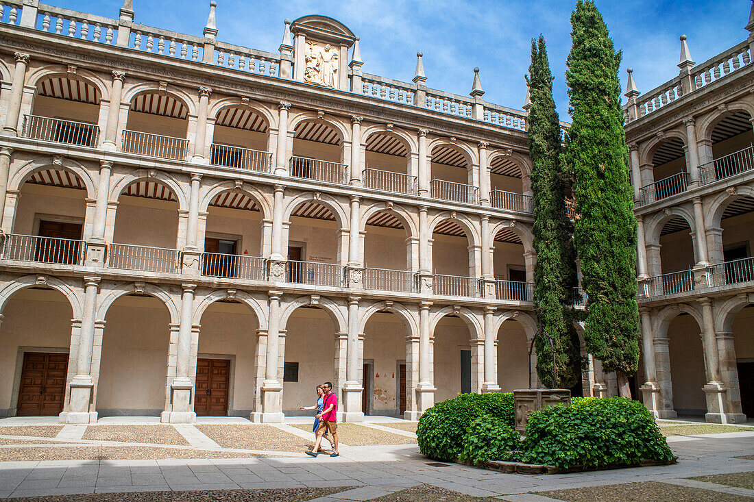 Alcala de Henares University building facade, Madrid Province, Spain. 17th century Patio Mayor of the Antigua Universidad or Colegio de San Ildefonso. The swan motif on the well is the emblem of Cardinal Cisneros the powerful cleric and statesman who founded the university (cisne meaning swan, in Spanish). The University and Historic Precinct of Alcala de Henares is a UNESCO World Heritage Site.