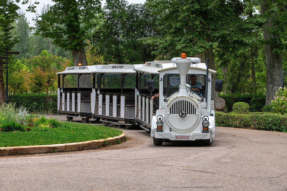 Chiquitren tourist train through the gardens of the Principe de Aranjuez, Madrid, Spain