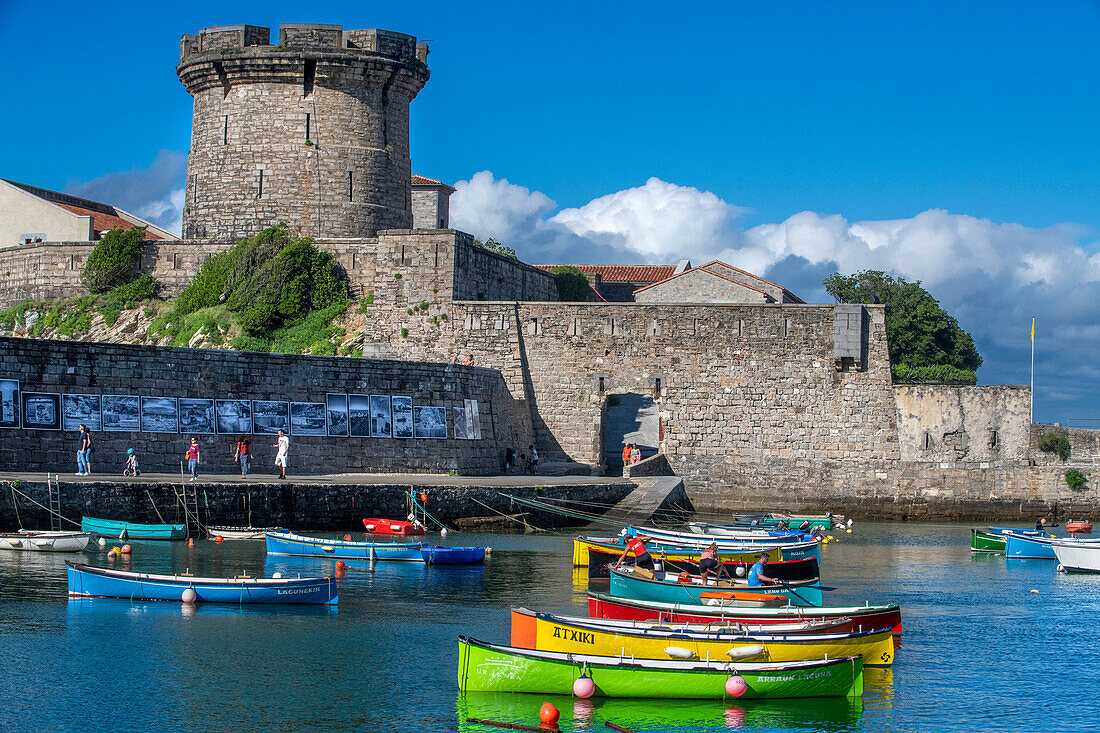 Le fort Vauvan de Socoa and the fishing harbour of Ciboure, Basque country. France Small coloreful fish boats on the old port of cituadel in front of Saint Jean de luz.