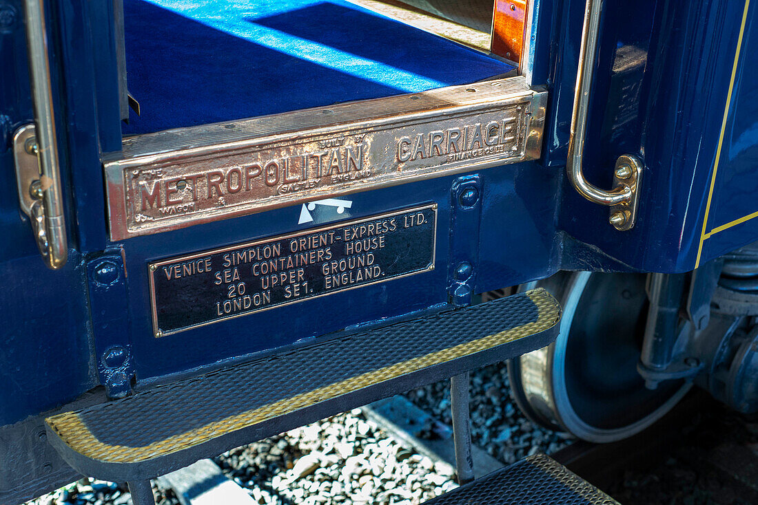 Sign trade brand of Belmond Venice Simplon Orient Express luxury train stoped at Innsbruck Hauptbahnhof train station railway station the central railway station in Innsbruck Austria.