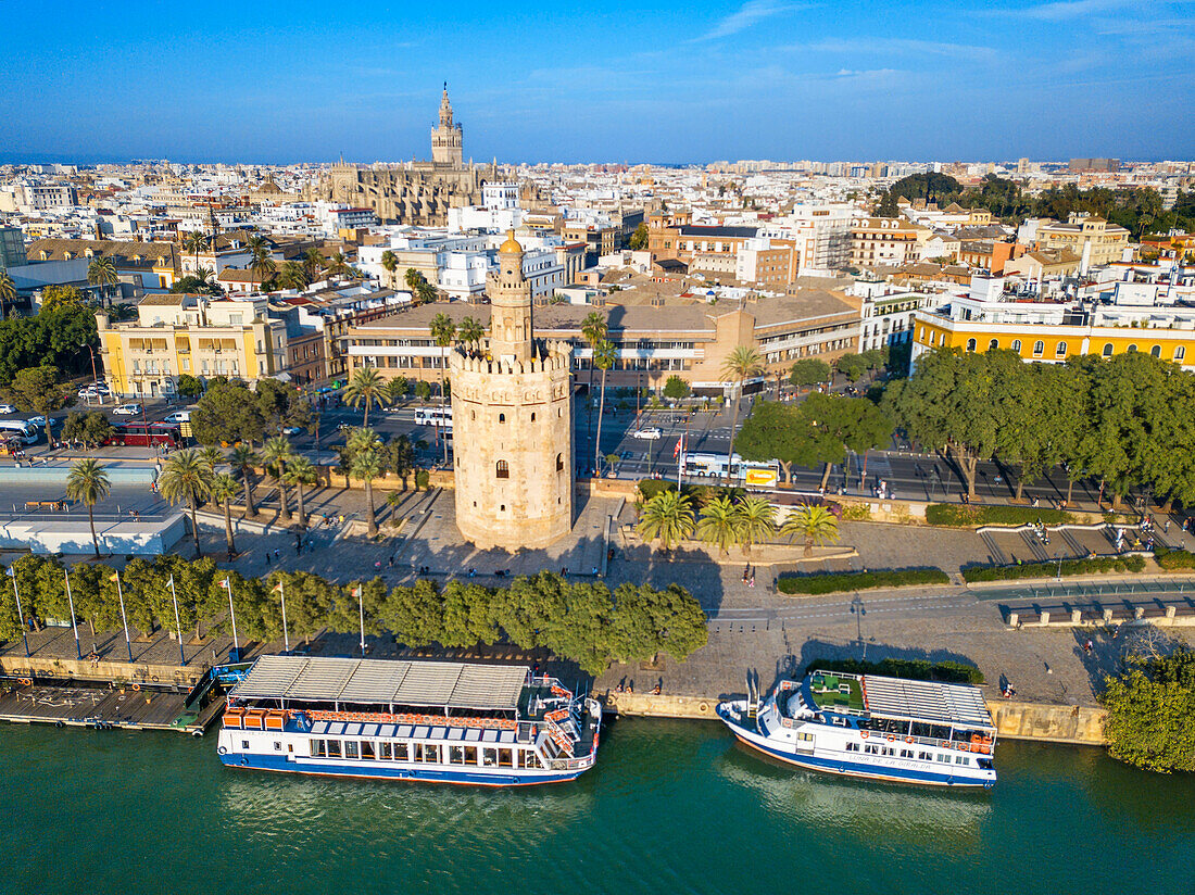 Aerial view of Guadalquivir river and The Torre del Oro what translates to Tower of Gold - historical landmark from XIII century in Seville, Andalusia, Spain