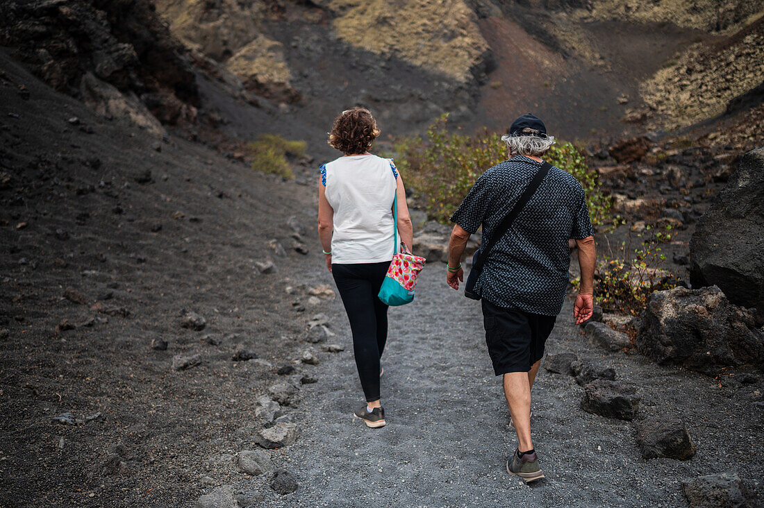 Volcan del Cuervo (Crow volcano) a crater explored by a loop trail in a barren, rock-strewn landscape