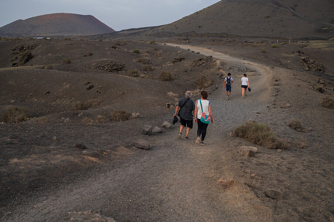 Volcan del Cuervo (Crow volcano) a crater explored by a loop trail in a barren, rock-strewn landscape