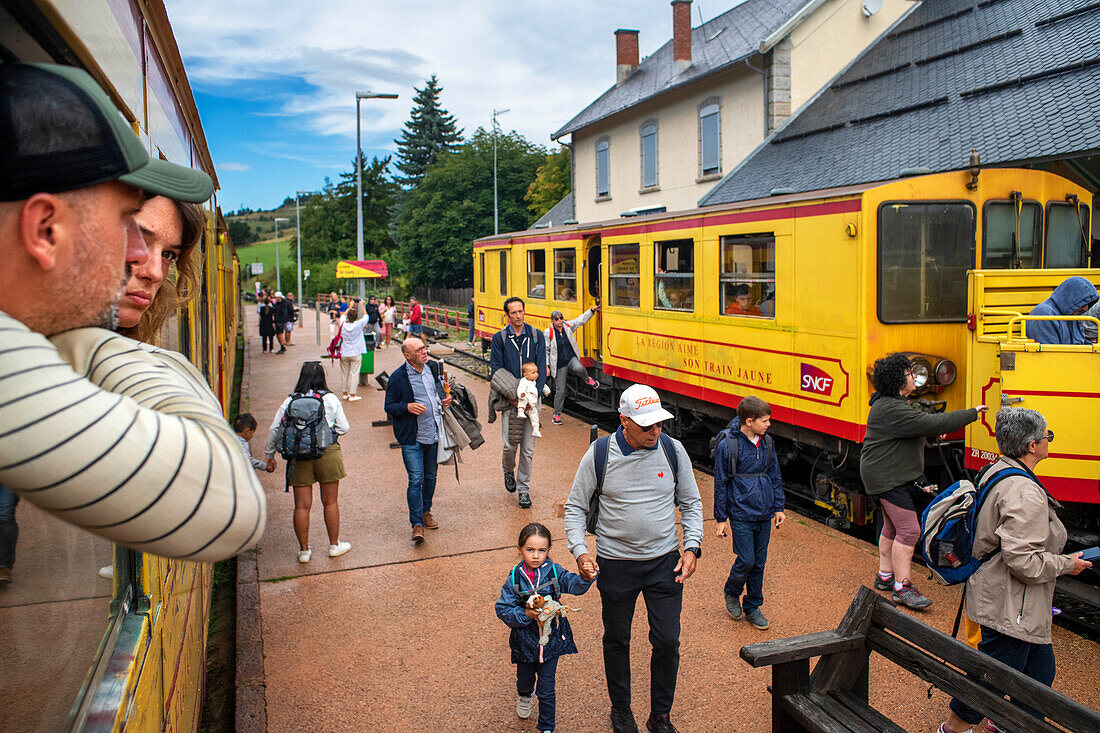 Passengers in Mont Louis La cabanasse train station. The Yellow Train or Train Jaune, Pyrénées-Orientales, Languedoc-Roussillon, France.