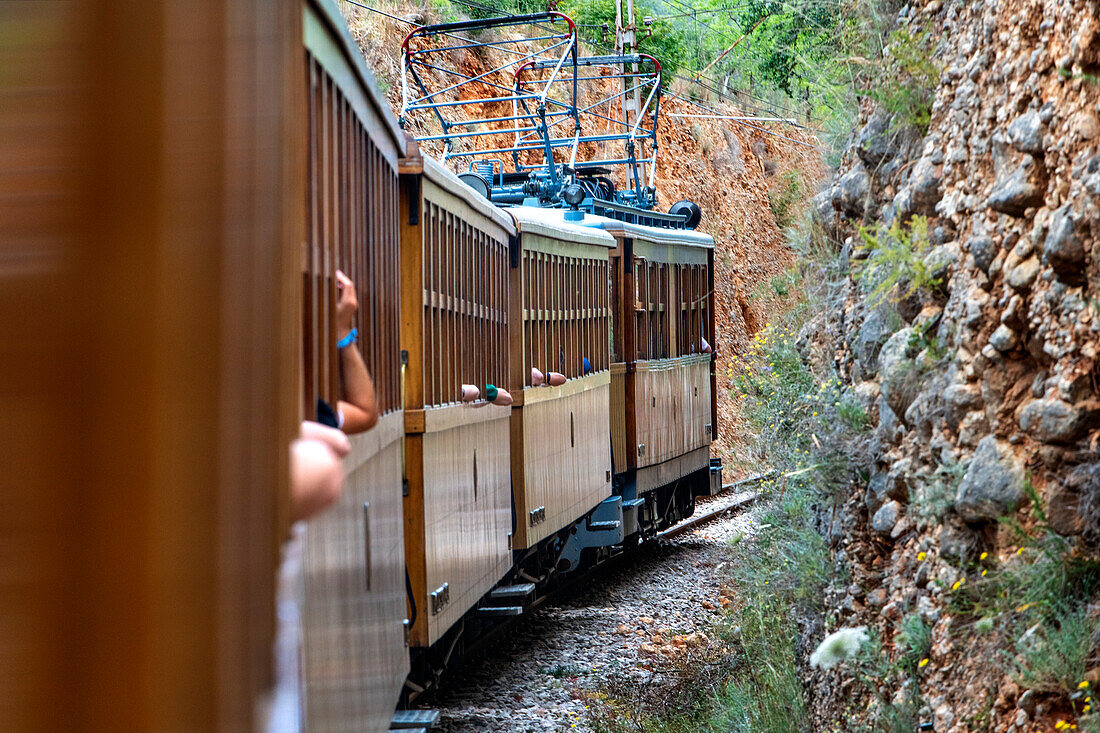 Landscape from the window of tren de Soller train vintage historic train that connects Palma de Mallorca to Soller, Majorca, Balearic Islands, Spain, Mediterranean, Europe.