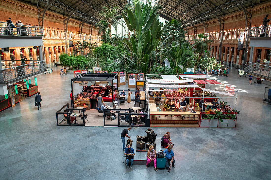 Greenhouse in Principal Hall. Bars and restaurants in Atocha train station in Madrid, Spain.