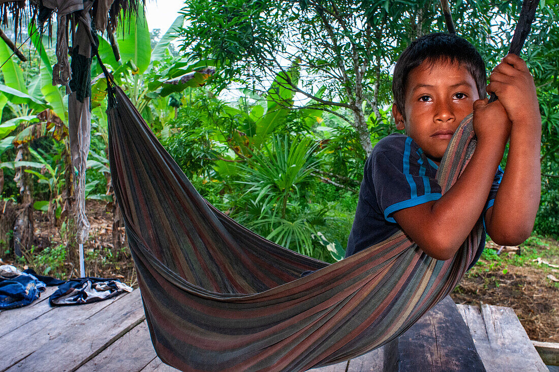 Boy of the riverside village of Timicuro I. Iqutios peruvian amazon, Loreto, Peru