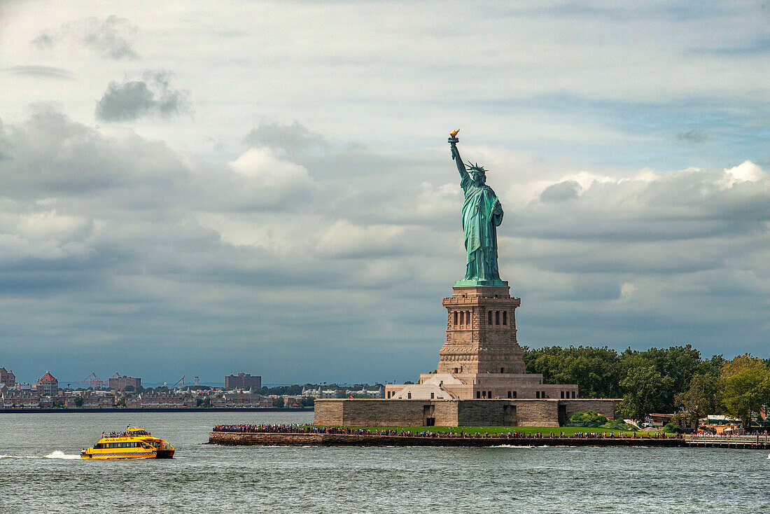 Statue of Liberty in New York and the water ferry taxi