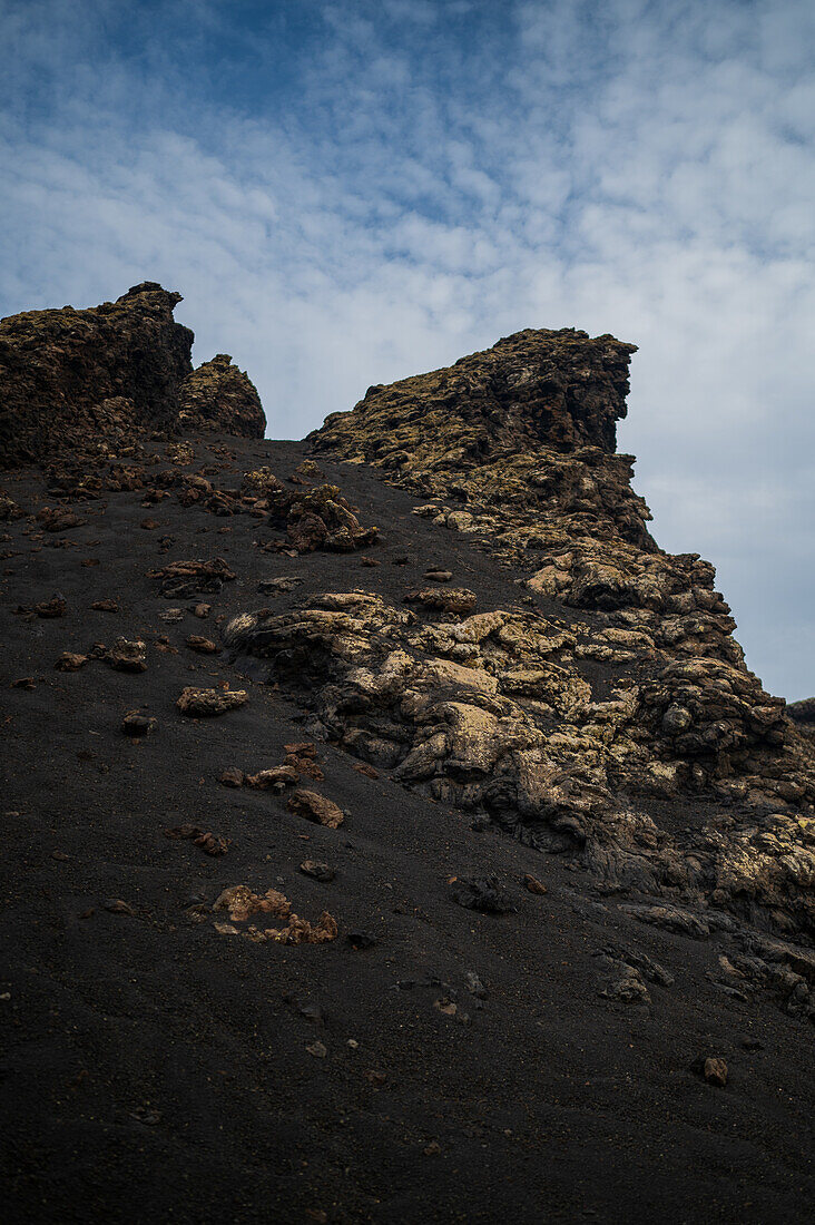 Volcan del Cuervo (Crow volcano) a crater explored by a loop trail in a barren, rock-strewn landscape