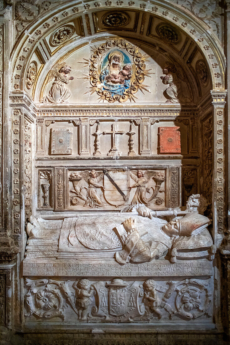 An effigy in the Chapel of tomb of the Doncel, or young Knight, a much visited section of Siguenza Cathedral, Spain. He died in 1486 when he was 14, young nobleman Martín Vázquez de Arce (1460-1486), portrait statue in his tomb in the Cathedral of Sigüenza (Guadalajara), made in polychromed alabaster, 1486-1504.