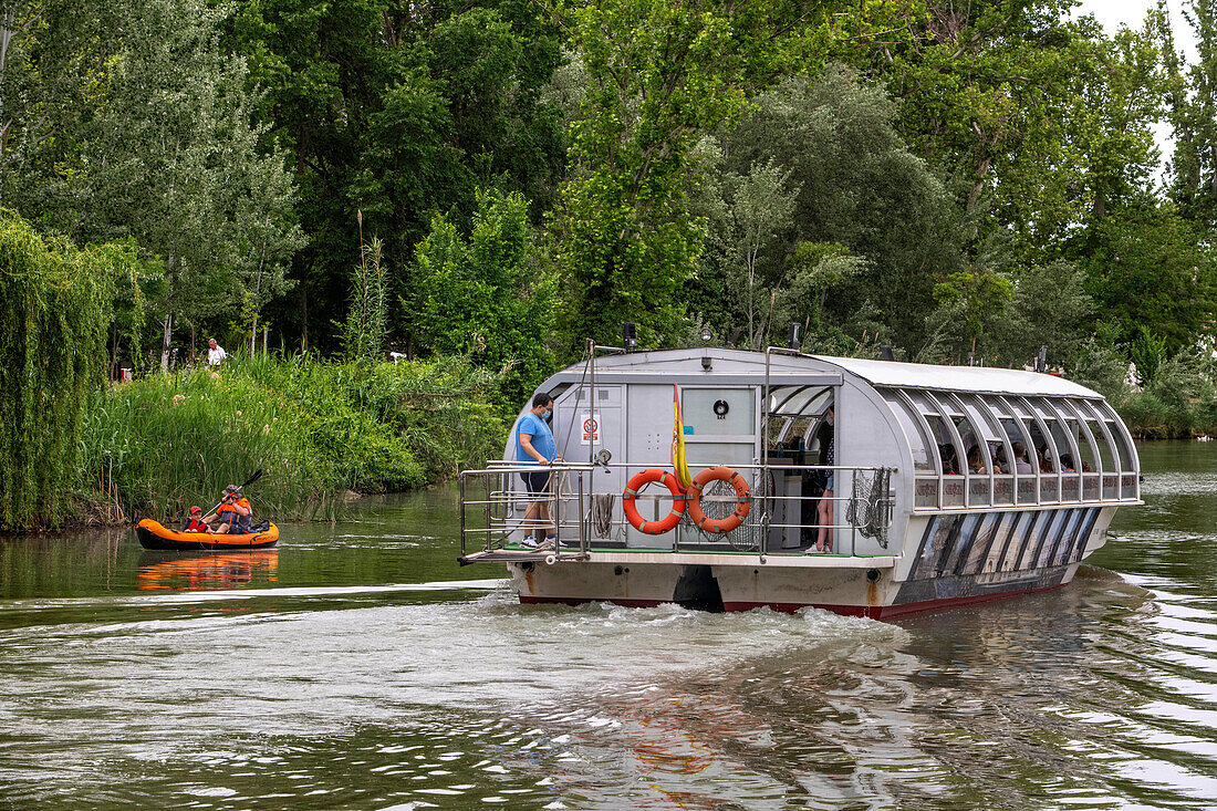 Kayak and boat excrusion on rio Tajo river or Tagus river in the La Isla garden Aranjuez Spain.