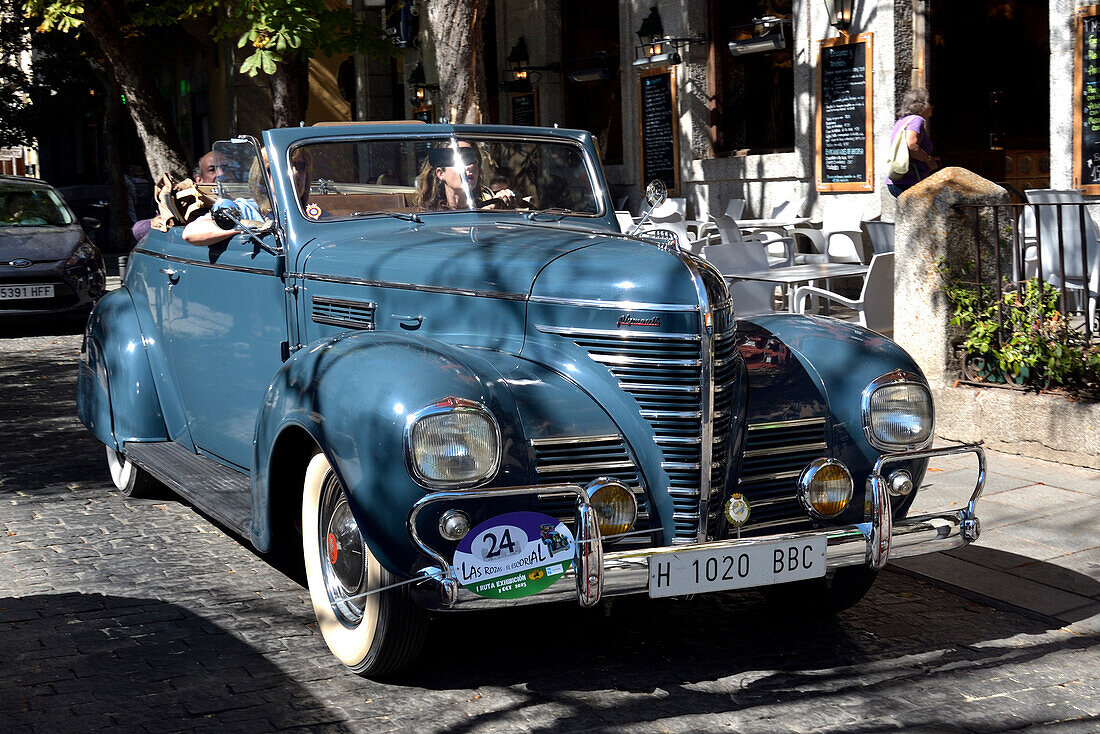 A Plymouth classic car on the road in a car festival in San Lorenzo de El Escorial, Madrid.