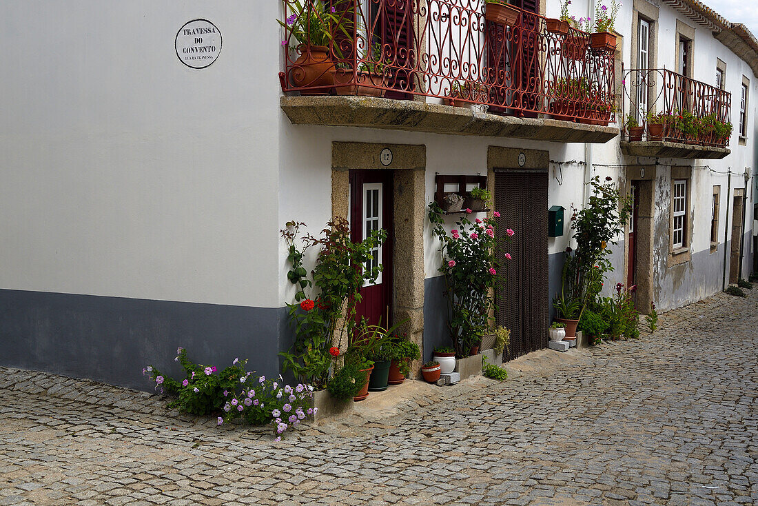 House with flowers in Almeida, Portugal.