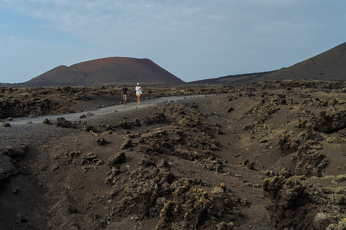 Volcan del Cuervo (Crow volcano) a crater explored by a loop trail in a barren, rock-strewn landscape