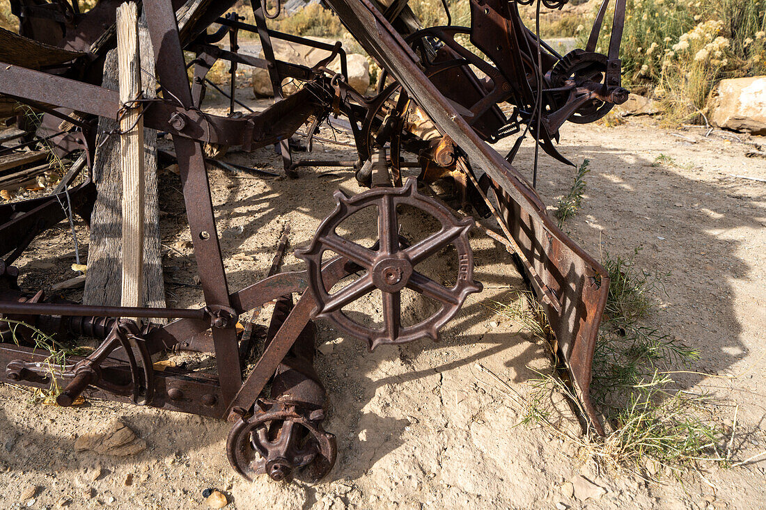 Mechanical detail of a vintage Deering New Ideal grain binding machine at Cottonwood Glen in Nine Mile Canyon, Utah.